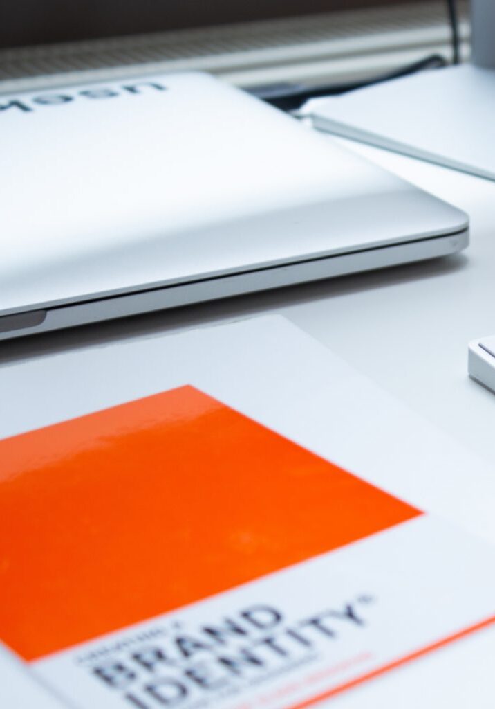 laptop and book on desk